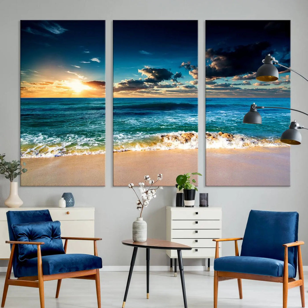 The Ocean Breeze Beach Sunset Wall Art Canvas Print—a captivating triptych of a beach sunset—adds a stunning coastal charm to the room, making it ideal for home or cabin decor.