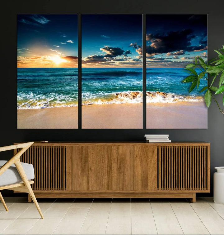 The Ocean Breeze Beach Sunset Wall Art Canvas Print—a captivating triptych of a beach sunset—adds a stunning coastal charm to the room, making it ideal for home or cabin decor.