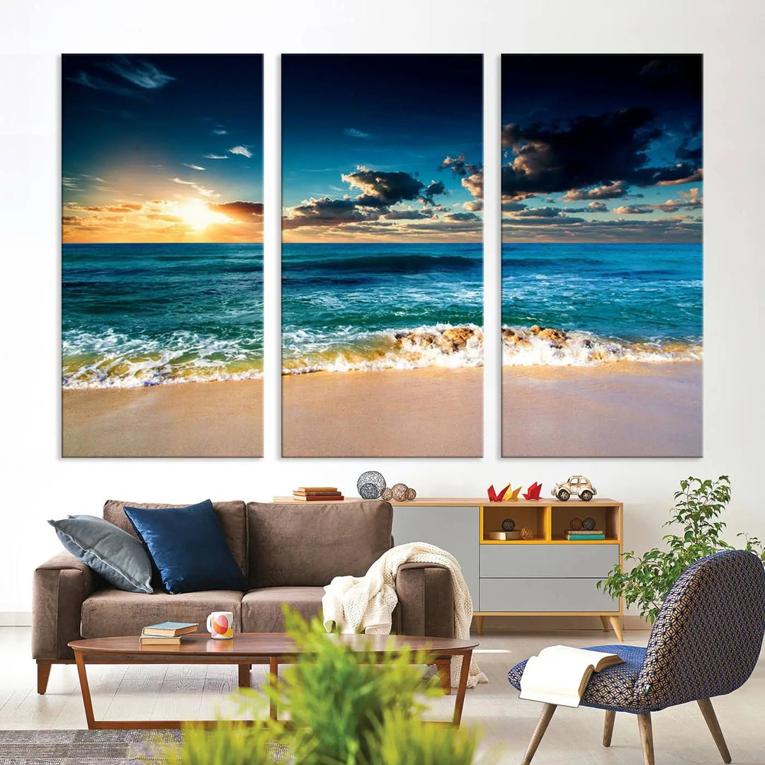 The Ocean Breeze Beach Sunset Wall Art Canvas Print—a captivating triptych of a beach sunset—adds a stunning coastal charm to the room, making it ideal for home or cabin decor.