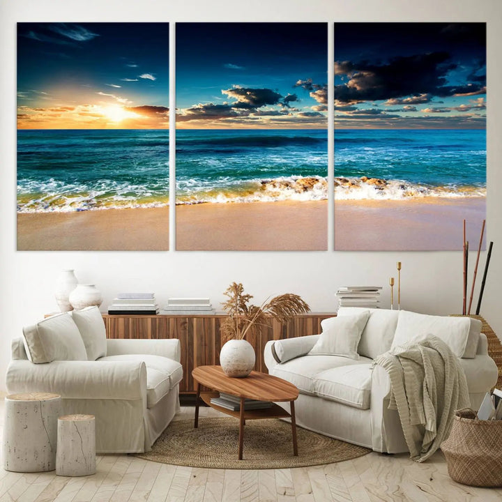 The Ocean Breeze Beach Sunset Wall Art Canvas Print—a captivating triptych of a beach sunset—adds a stunning coastal charm to the room, making it ideal for home or cabin decor.