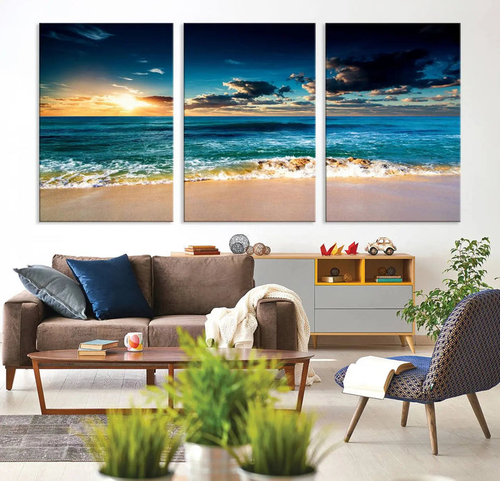 The Ocean Breeze Beach Sunset Wall Art Canvas Print—a captivating triptych of a beach sunset—adds a stunning coastal charm to the room, making it ideal for home or cabin decor.