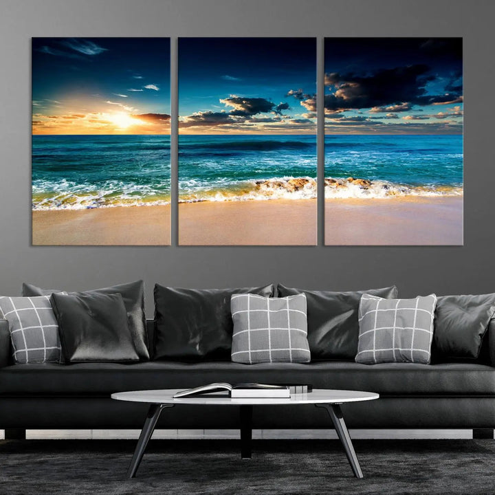 The Ocean Breeze Beach Sunset Wall Art Canvas Print—a captivating triptych of a beach sunset—adds a stunning coastal charm to the room, making it ideal for home or cabin decor.