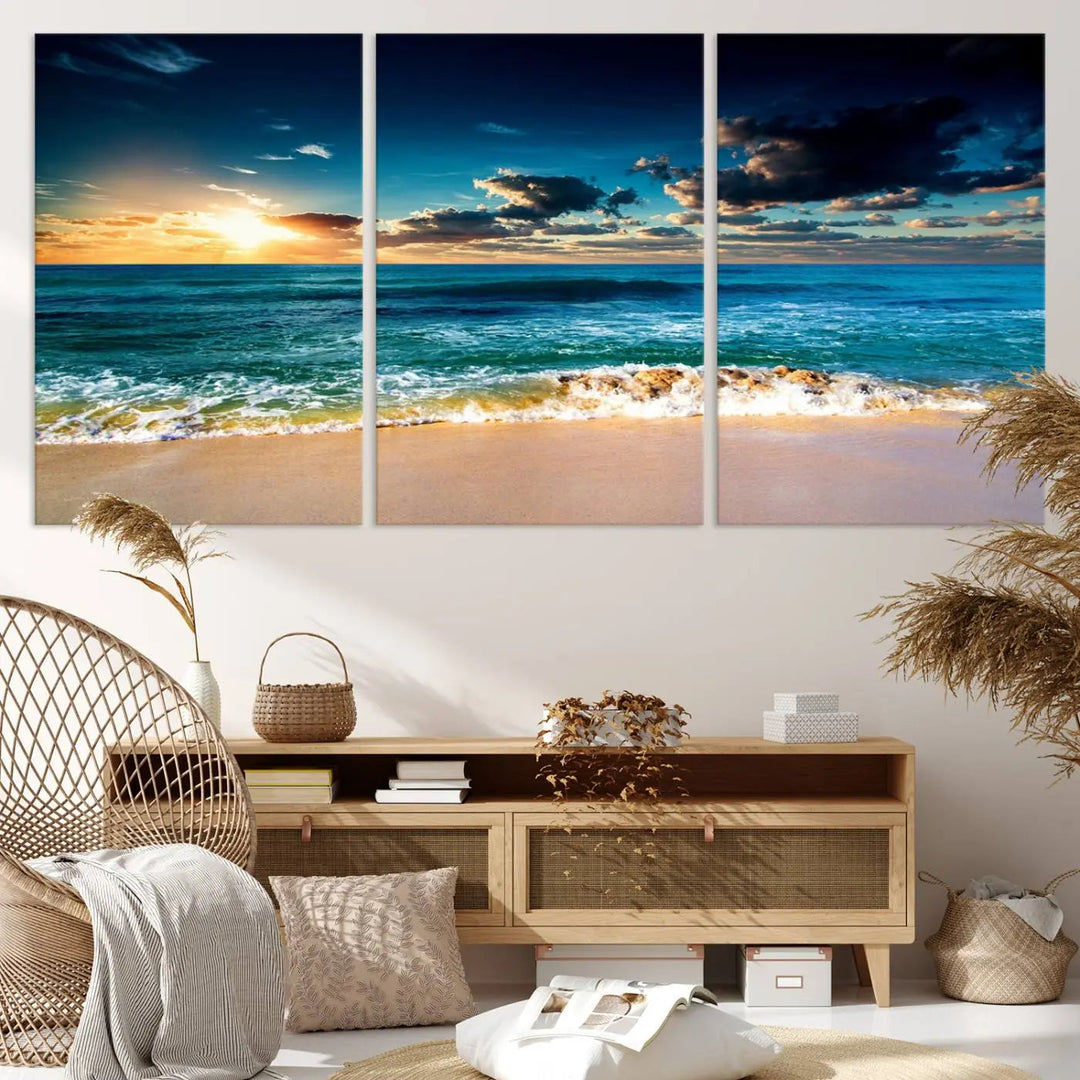 The Ocean Breeze Beach Sunset Wall Art Canvas Print—a captivating triptych of a beach sunset—adds a stunning coastal charm to the room, making it ideal for home or cabin decor.