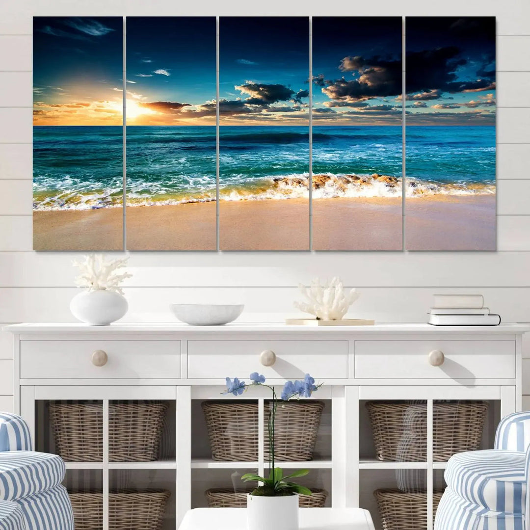 The Ocean Breeze Beach Sunset Wall Art Canvas Print—a captivating triptych of a beach sunset—adds a stunning coastal charm to the room, making it ideal for home or cabin decor.