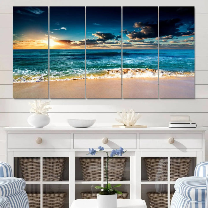 The Ocean Breeze Beach Sunset Wall Art Canvas Print—a captivating triptych of a beach sunset—adds a stunning coastal charm to the room, making it ideal for home or cabin decor.