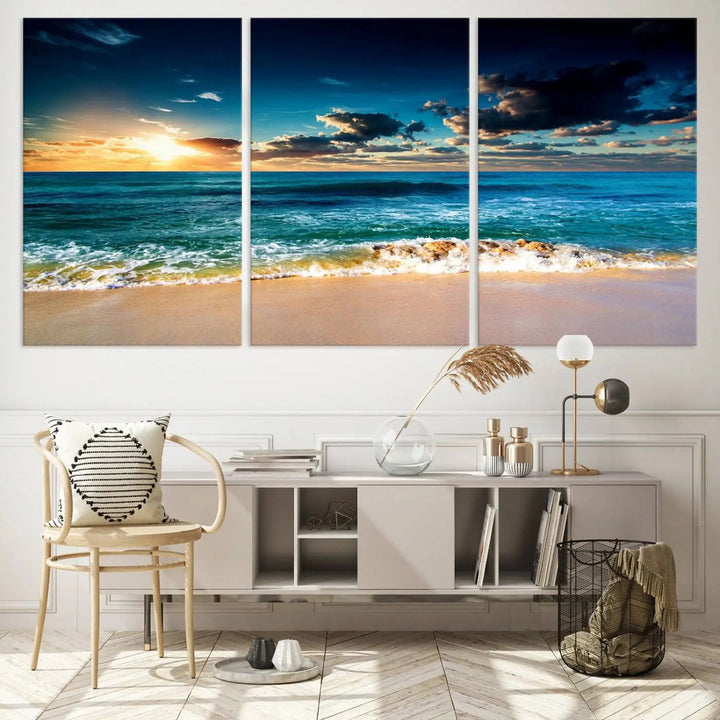 The Ocean Breeze Beach Sunset Wall Art Canvas Print—a captivating triptych of a beach sunset—adds a stunning coastal charm to the room, making it ideal for home or cabin decor.