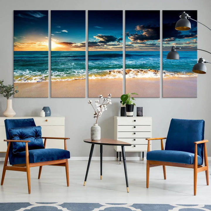 The Ocean Breeze Beach Sunset Wall Art Canvas Print—a captivating triptych of a beach sunset—adds a stunning coastal charm to the room, making it ideal for home or cabin decor.