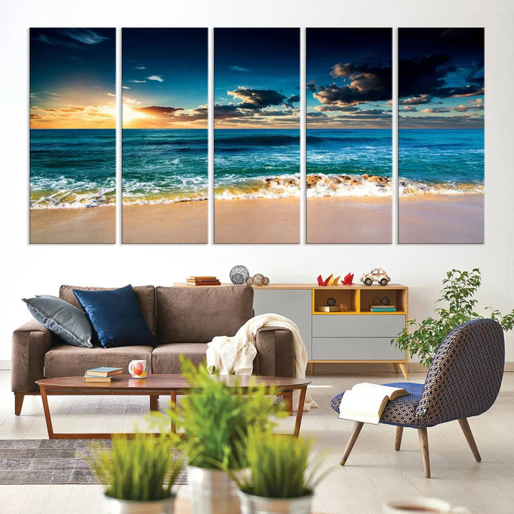 The Ocean Breeze Beach Sunset Wall Art Canvas Print—a captivating triptych of a beach sunset—adds a stunning coastal charm to the room, making it ideal for home or cabin decor.