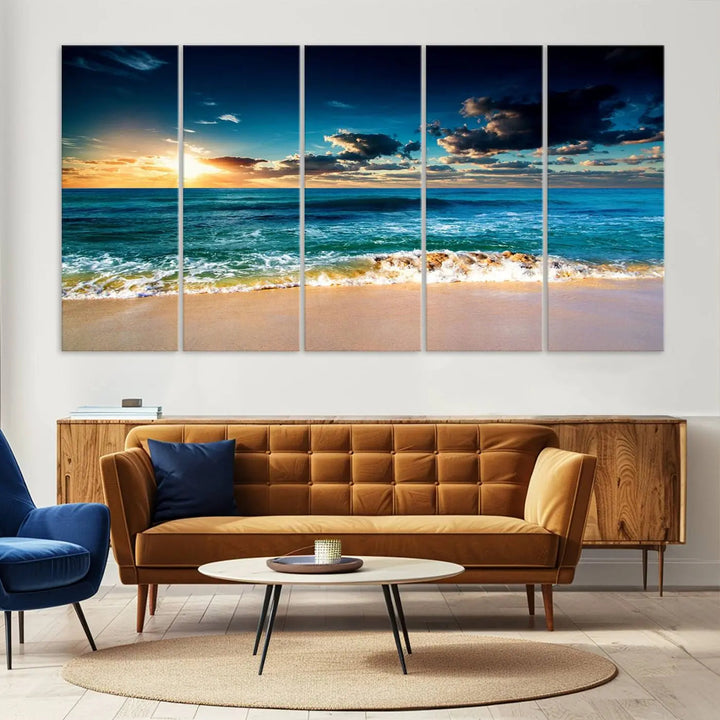 The Ocean Breeze Beach Sunset Wall Art Canvas Print—a captivating triptych of a beach sunset—adds a stunning coastal charm to the room, making it ideal for home or cabin decor.