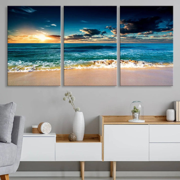 The Ocean Breeze Beach Sunset Wall Art Canvas Print—a captivating triptych of a beach sunset—adds a stunning coastal charm to the room, making it ideal for home or cabin decor.