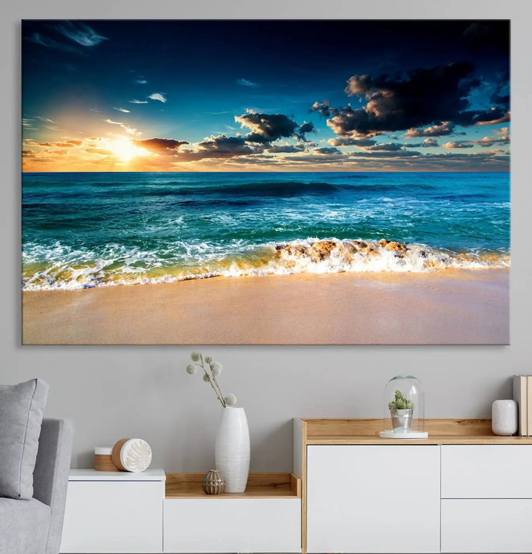 The Ocean Breeze Beach Sunset Wall Art Canvas Print—a captivating triptych of a beach sunset—adds a stunning coastal charm to the room, making it ideal for home or cabin decor.