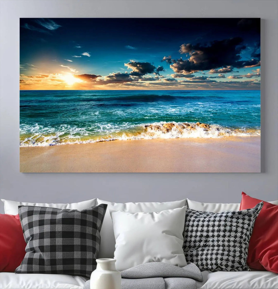 The Ocean Breeze Beach Sunset Wall Art Canvas Print—a captivating triptych of a beach sunset—adds a stunning coastal charm to the room, making it ideal for home or cabin decor.