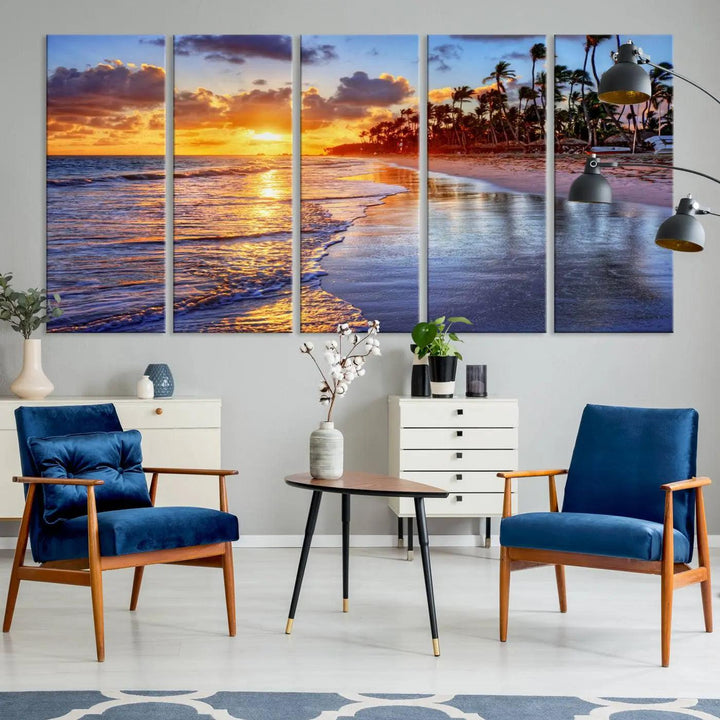 The dining area features a stunning Ocean Sunset Beach Canvas Print—a five-panel coastal wall art and tropical seascape triptych that beautifully captures the serene beauty of ocean waves set against a beach sunset scene.