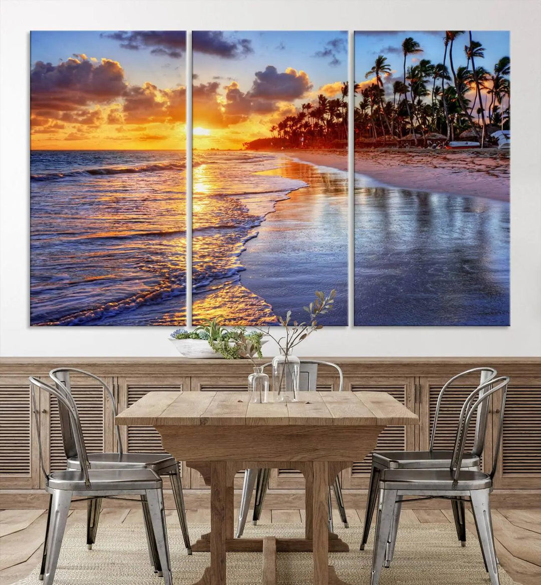 The dining area features a stunning Ocean Sunset Beach Canvas Print—a five-panel coastal wall art and tropical seascape triptych that beautifully captures the serene beauty of ocean waves set against a beach sunset scene.