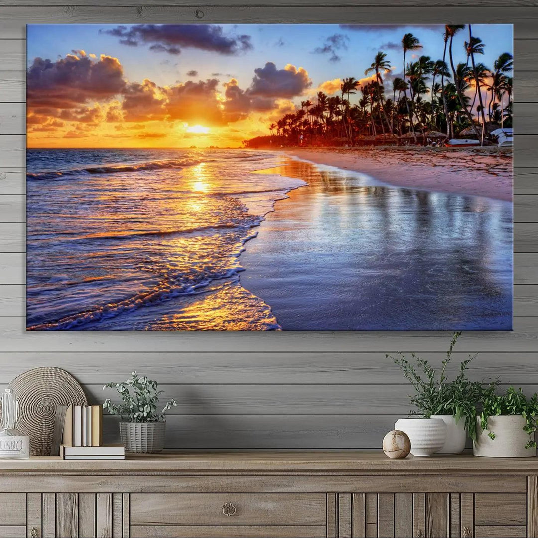 The dining area features a stunning Ocean Sunset Beach Canvas Print—a five-panel coastal wall art and tropical seascape triptych that beautifully captures the serene beauty of ocean waves set against a beach sunset scene.