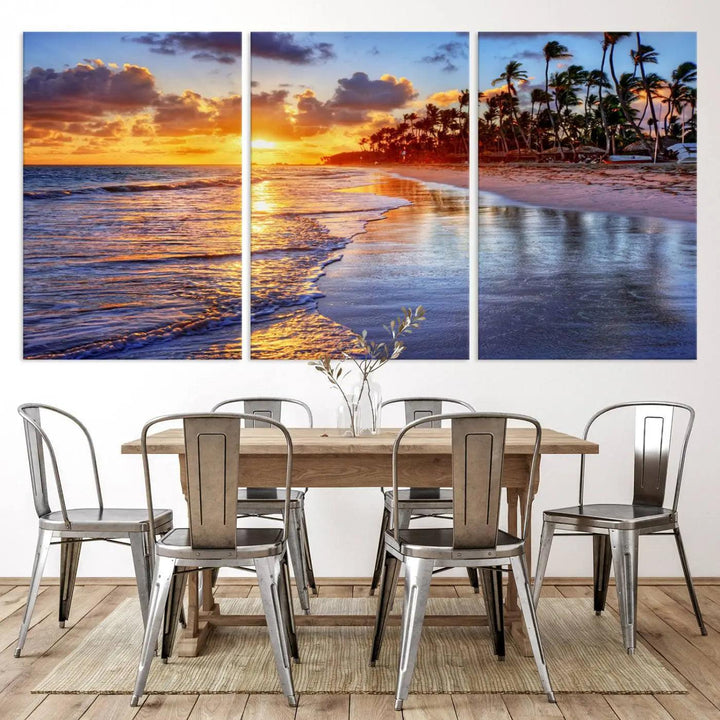 The dining area features a stunning Ocean Sunset Beach Canvas Print—a five-panel coastal wall art and tropical seascape triptych that beautifully captures the serene beauty of ocean waves set against a beach sunset scene.