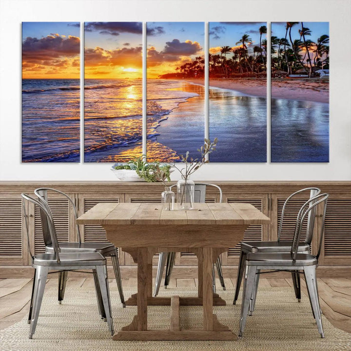 The dining area features a stunning Ocean Sunset Beach Canvas Print—a five-panel coastal wall art and tropical seascape triptych that beautifully captures the serene beauty of ocean waves set against a beach sunset scene.