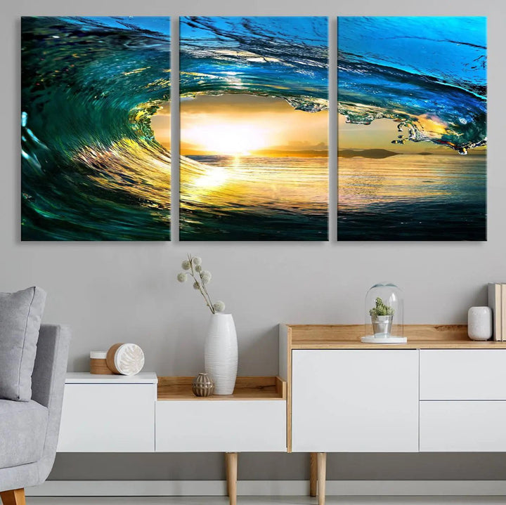 A modern dining room with a coastal vibe showcases a striking large wall print, the "Ocean Wave at Sunset Canvas Art," depicting vibrant water waves. The room features abstract wave artwork on the walls. This eye-catching piece of coastal art infuses the space with seaside serenity.