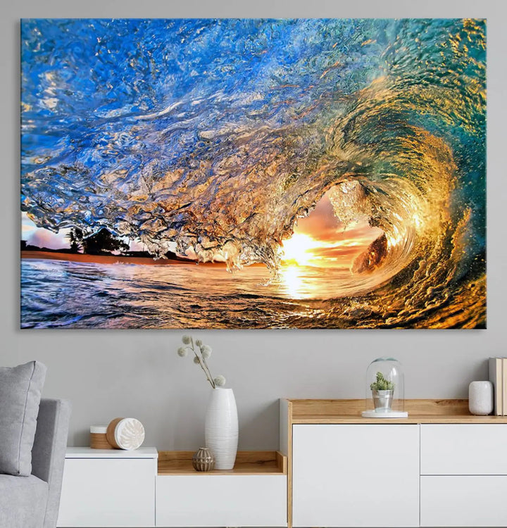 The Ocean Wave at Sunset Canvas Wall Art is a vibrant piece featuring coastal beach waves and a stunning sunset.