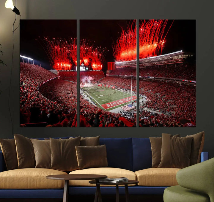 The Ohio State University Buckeyes Football Team Print showcases a vibrant Columbus Ohio Stadium, teeming with fans and illuminated by red fireworks against the night sky. Printed on premium canvas with a gallery-quality finish, this exquisite piece of wall art makes an elegant statement and enhances any space with sophistication.