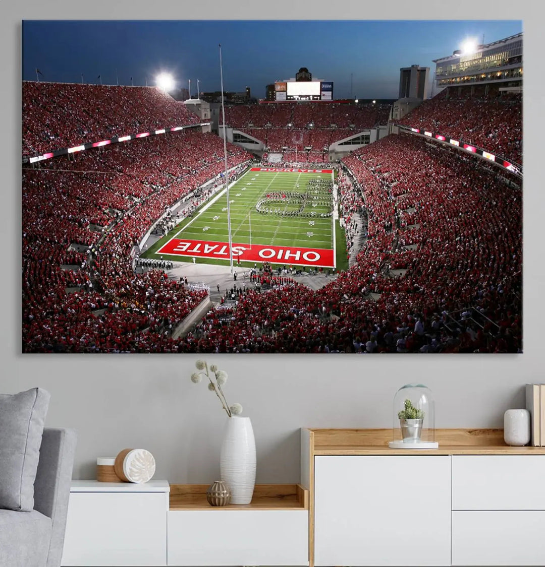 The Ohio State University Buckeyes Football Team Print, showcasing a vibrant view of the Columbus Ohio Stadium, is displayed in a modern room. Its gallery-quality finish enhances the space.