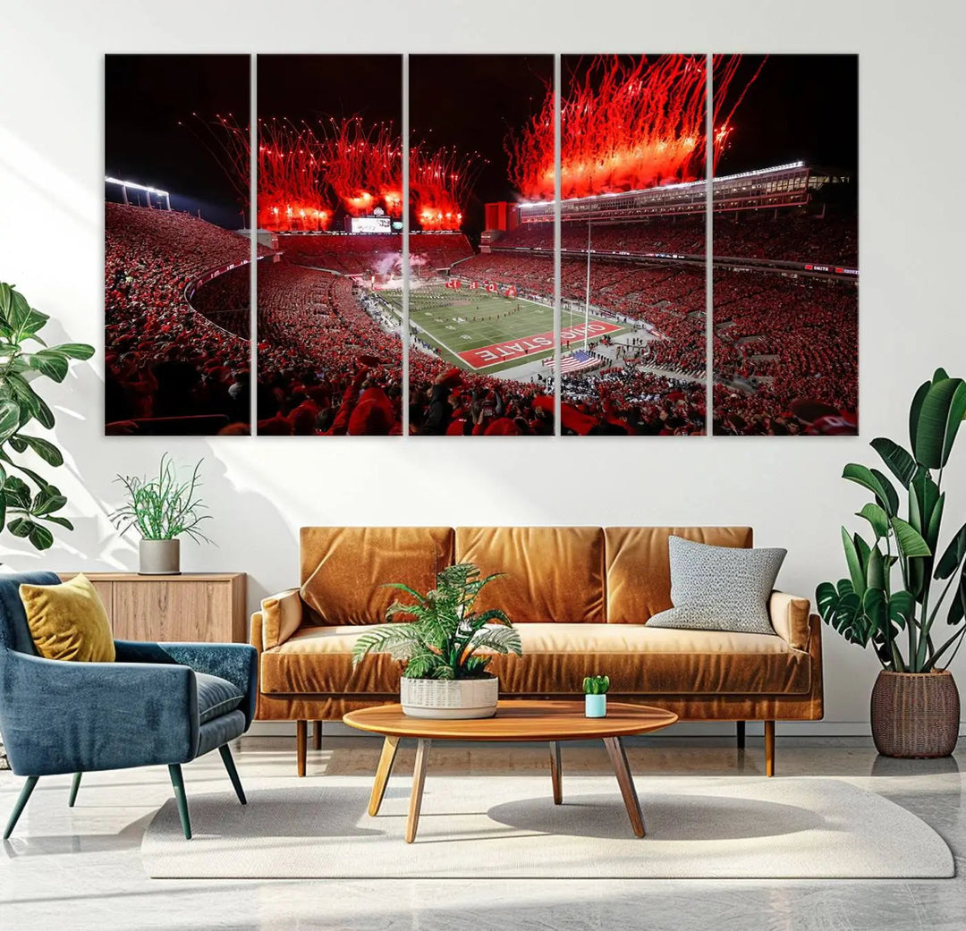 The Ohio State University Buckeyes Football Team Print showcases a vibrant Columbus Ohio Stadium, teeming with fans and illuminated by red fireworks against the night sky. Printed on premium canvas with a gallery-quality finish, this exquisite piece of wall art makes an elegant statement and enhances any space with sophistication.