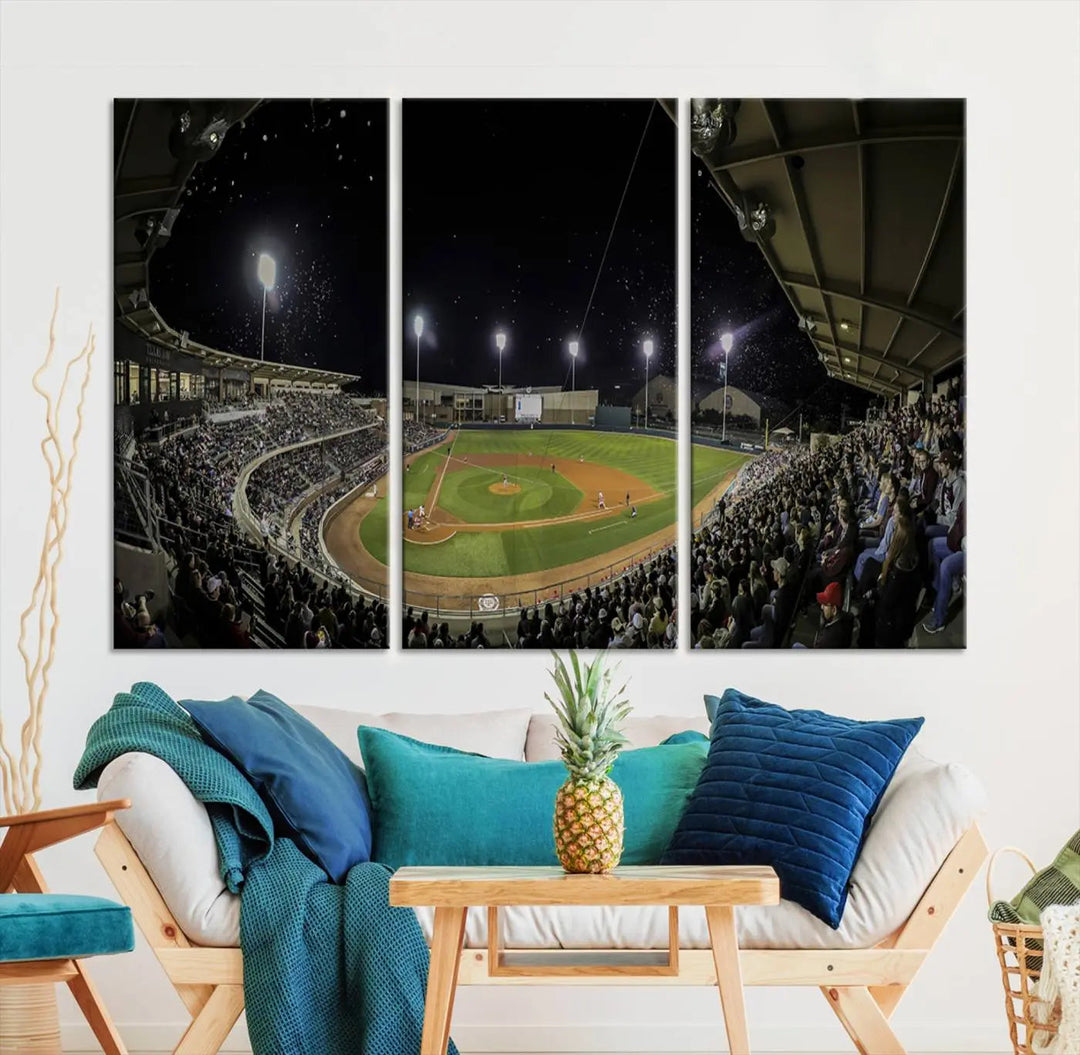 The living room is accentuated by the gallery-quality finish of a stunning three-panel canvas, the "Olsen Field at Blue Bell Park - Texas A&M Aggies Baseball Stadium Wall Art Canvas Print," beautifully depicting a baseball stadium at night.