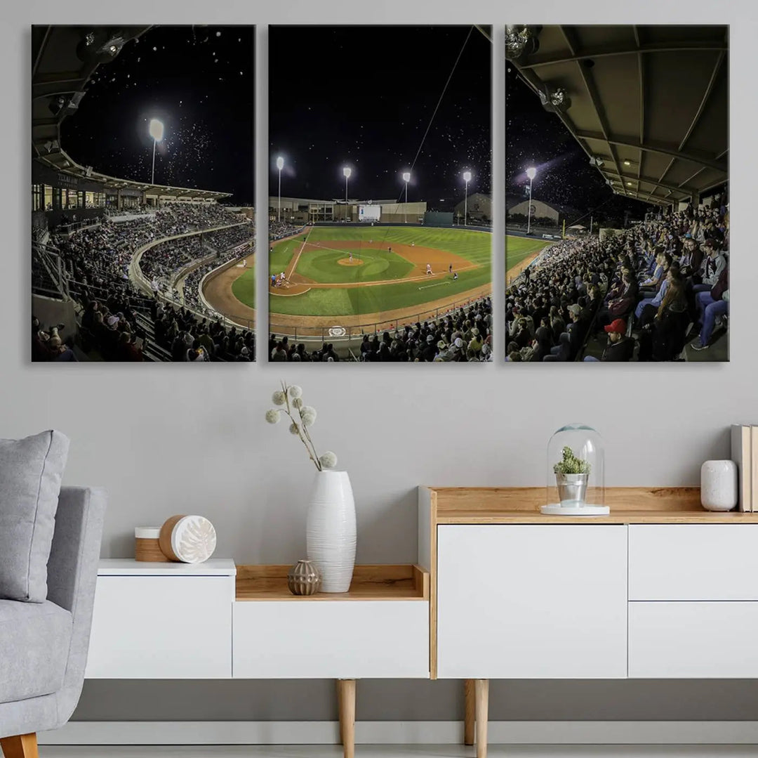 The living room is accentuated by the gallery-quality finish of a stunning three-panel canvas, the "Olsen Field at Blue Bell Park - Texas A&M Aggies Baseball Stadium Wall Art Canvas Print," beautifully depicting a baseball stadium at night.