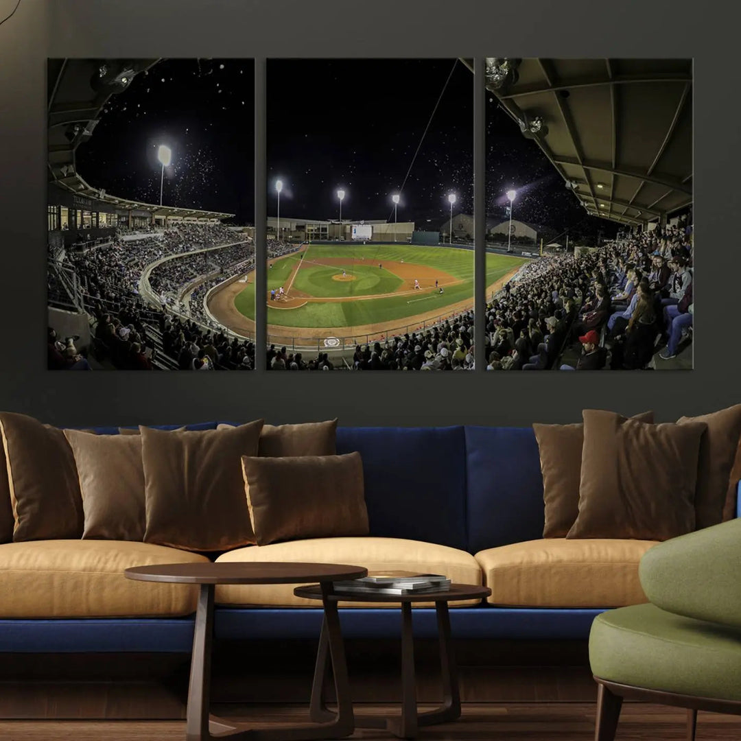 The living room is accentuated by the gallery-quality finish of a stunning three-panel canvas, the "Olsen Field at Blue Bell Park - Texas A&M Aggies Baseball Stadium Wall Art Canvas Print," beautifully depicting a baseball stadium at night.