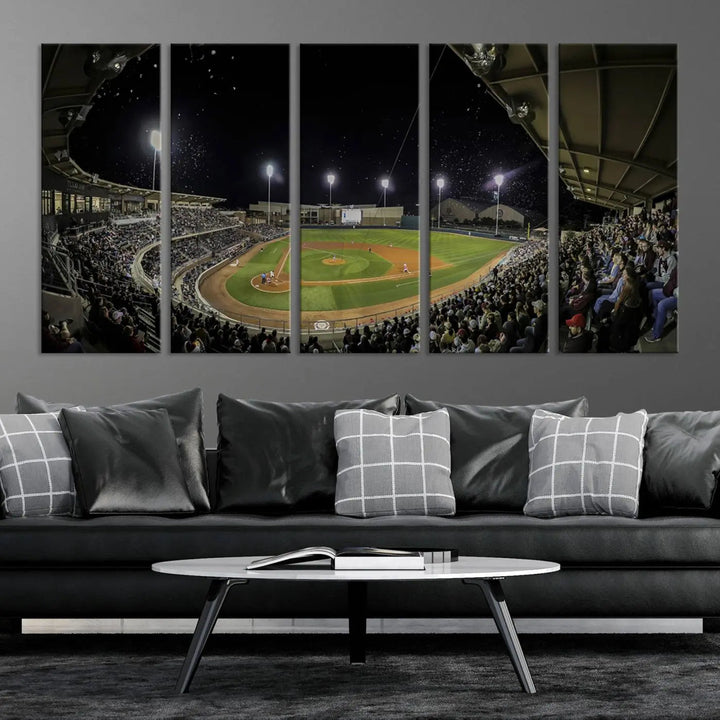 The living room is accentuated by the gallery-quality finish of a stunning three-panel canvas, the "Olsen Field at Blue Bell Park - Texas A&M Aggies Baseball Stadium Wall Art Canvas Print," beautifully depicting a baseball stadium at night.