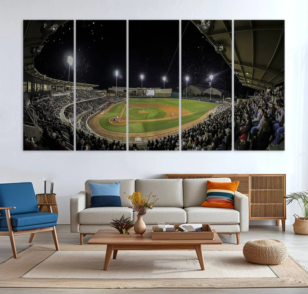 The living room is accentuated by the gallery-quality finish of a stunning three-panel canvas, the "Olsen Field at Blue Bell Park - Texas A&M Aggies Baseball Stadium Wall Art Canvas Print," beautifully depicting a baseball stadium at night.