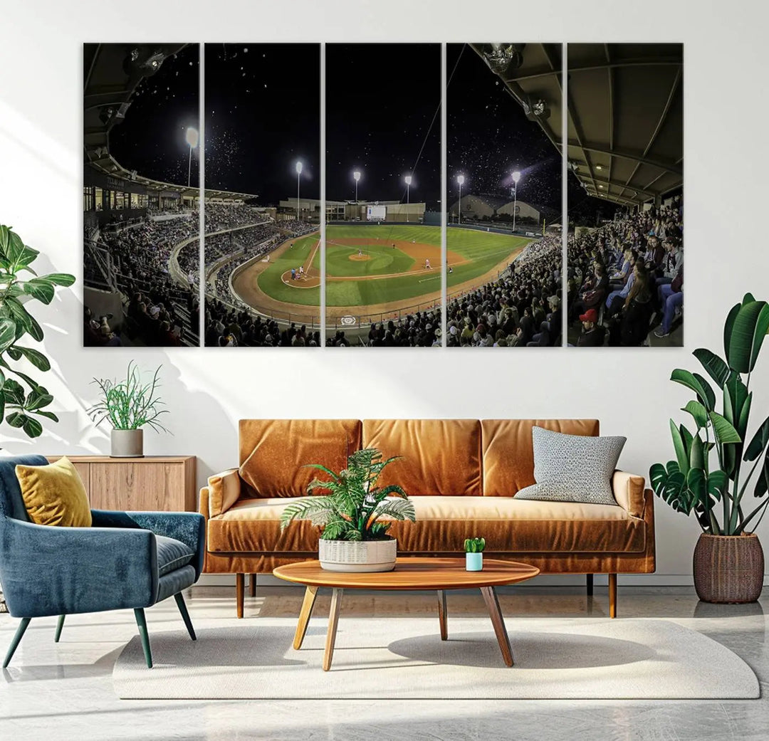 The living room is accentuated by the gallery-quality finish of a stunning three-panel canvas, the "Olsen Field at Blue Bell Park - Texas A&M Aggies Baseball Stadium Wall Art Canvas Print," beautifully depicting a baseball stadium at night.