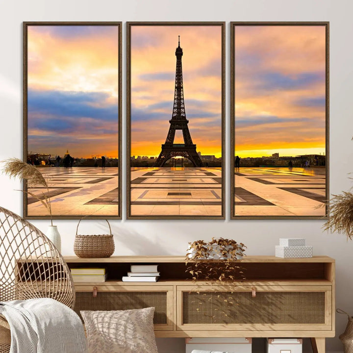 A captivating Paris Eiffel Tower Sunset Canvas Wall Art Print, featuring vibrant colors and showcasing the iconic landmark, is elegantly displayed in a frame on a wooden wall.