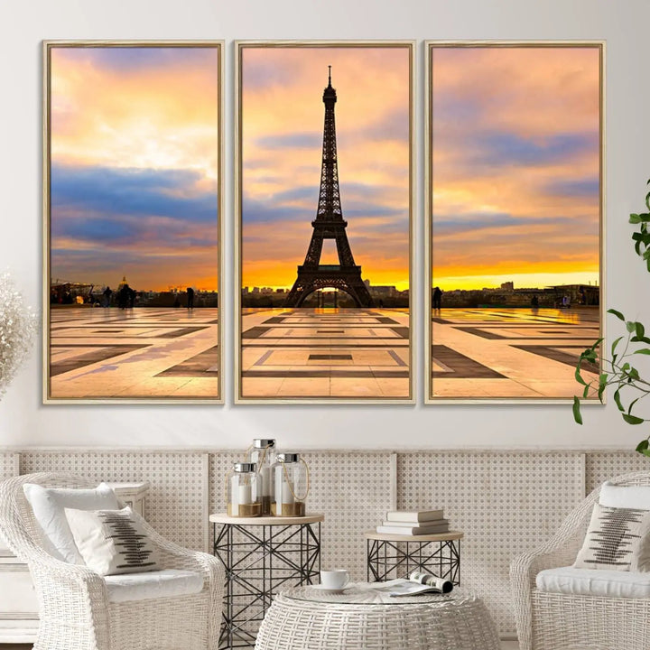 A captivating Paris Eiffel Tower Sunset Canvas Wall Art Print, featuring vibrant colors and showcasing the iconic landmark, is elegantly displayed in a frame on a wooden wall.