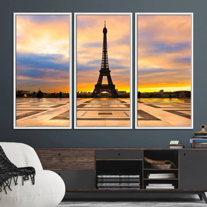 A captivating Paris Eiffel Tower Sunset Canvas Wall Art Print, featuring vibrant colors and showcasing the iconic landmark, is elegantly displayed in a frame on a wooden wall.