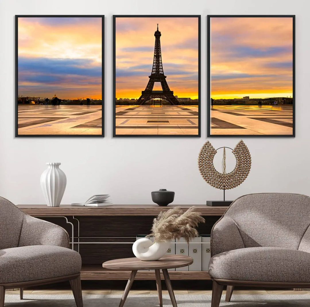 A captivating Paris Eiffel Tower Sunset Canvas Wall Art Print, featuring vibrant colors and showcasing the iconic landmark, is elegantly displayed in a frame on a wooden wall.