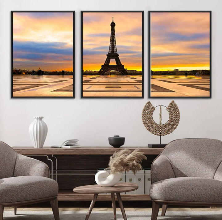 A captivating Paris Eiffel Tower Sunset Canvas Wall Art Print, featuring vibrant colors and showcasing the iconic landmark, is elegantly displayed in a frame on a wooden wall.