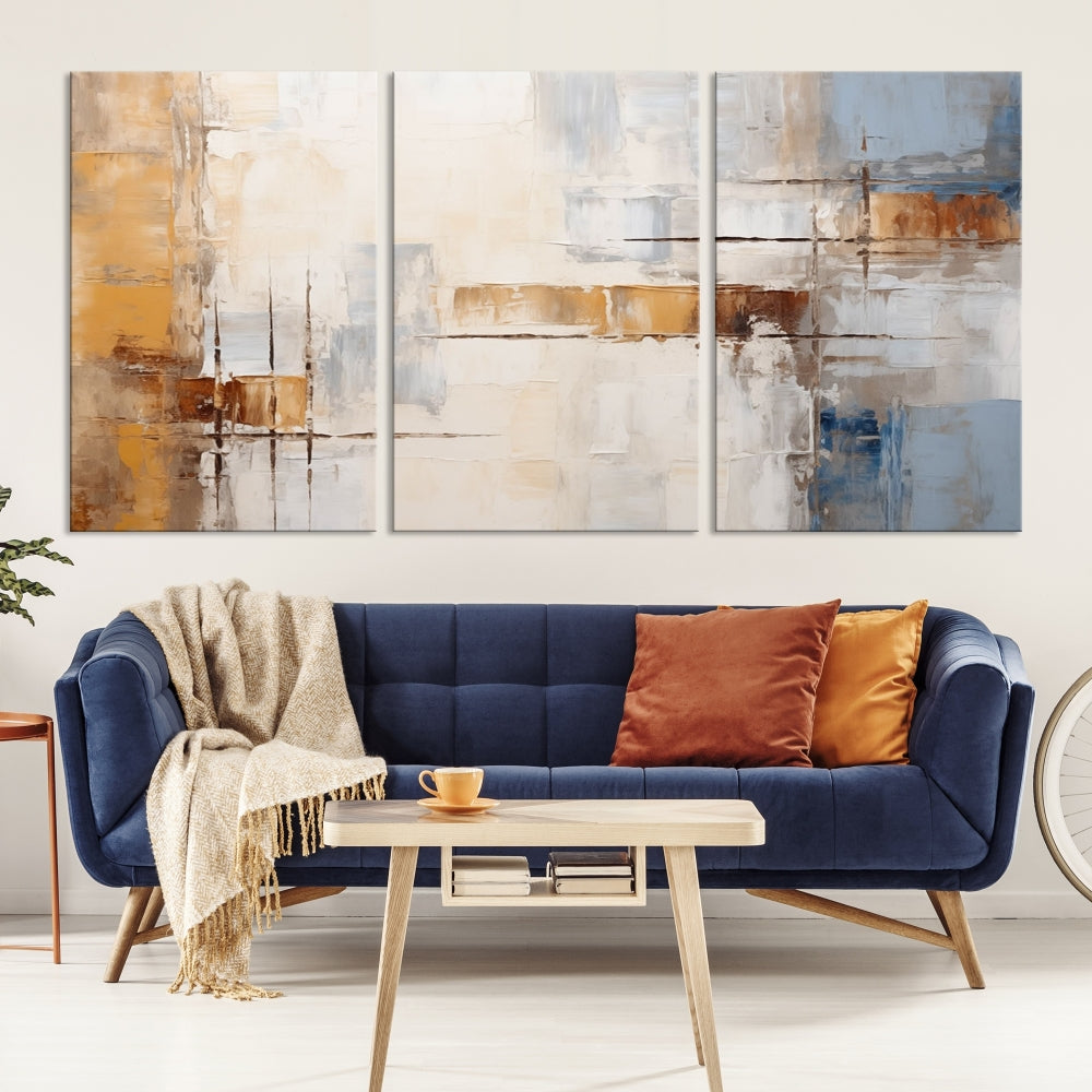 The Pastel Abstract Multi Panel Wall Art Canvas Print, featuring blue, white, and brown tones on museum-quality canvas, is ready to hang and includes a UV-protective coating for enduring vibrancy.