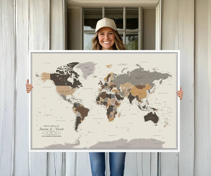 A large framed Personalized World Map Wall Art Canvas Print features custom text at the bottom, perfect for travel and exploration enthusiasts.