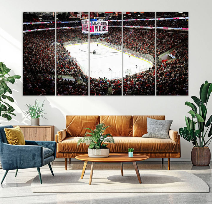 The living room features the PNC Arena Raleigh North Carolina Hurricanes Hockey Stadium Wall Art Canvas Print, which depicts a crowded ice hockey stadium with enthusiastic fans and an ongoing game, all rendered in high-resolution on museum-quality canvas.