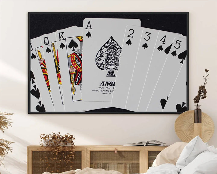 The Poker Wall Art - Playing Cards Canvas Wall Art Print features an Ace of Spades and Royal Flush design. This piece adds a classic charm to any space with its subtle emphasis on the Ace of Spades, making it perfect for game room decor.