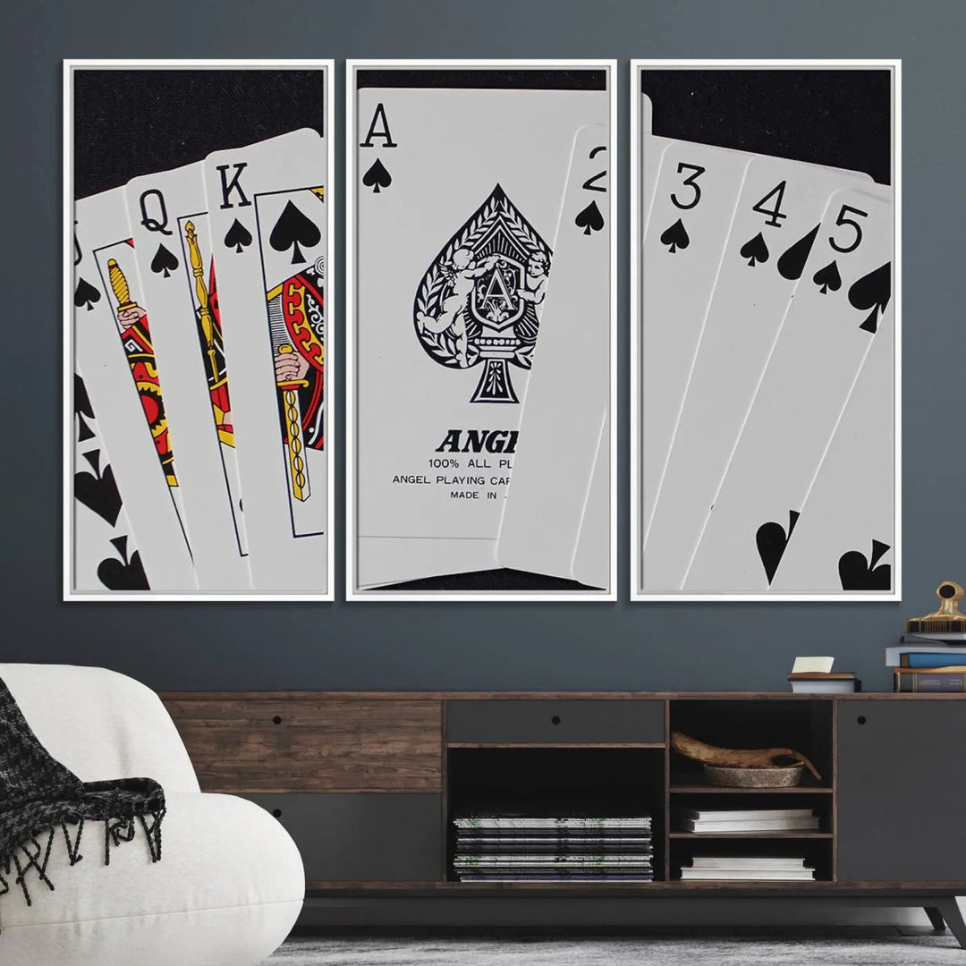 The Poker Wall Art - Playing Cards Canvas Wall Art Print features an Ace of Spades and Royal Flush design. This piece adds a classic charm to any space with its subtle emphasis on the Ace of Spades, making it perfect for game room decor.