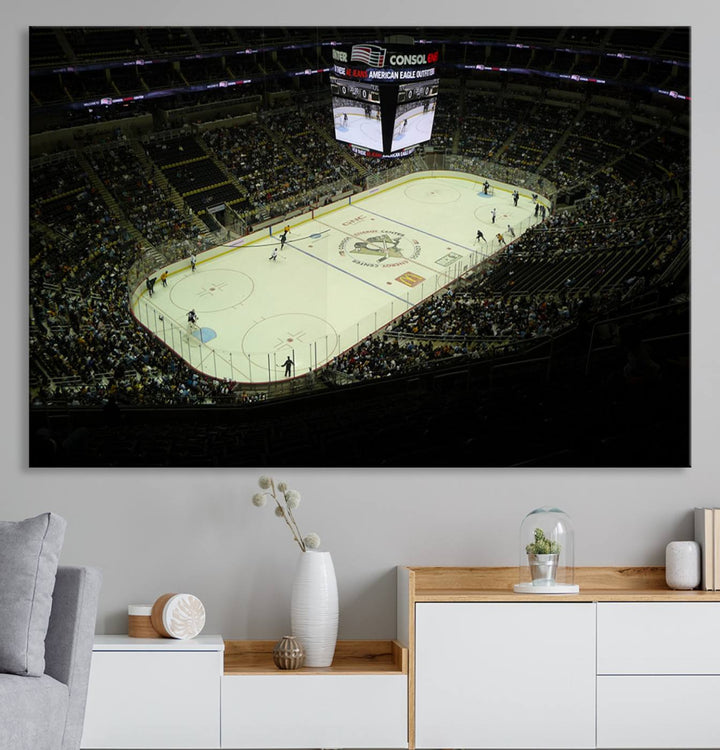 This museum-quality canvas captures a stunning aerial view of an ice hockey game at the PPG Paints Arena, home of the Pittsburgh Penguins in Pennsylvania. The artwork features a well-lit arena with a digital scoreboard above the rink, delivered in high-resolution printing and ready to hang.