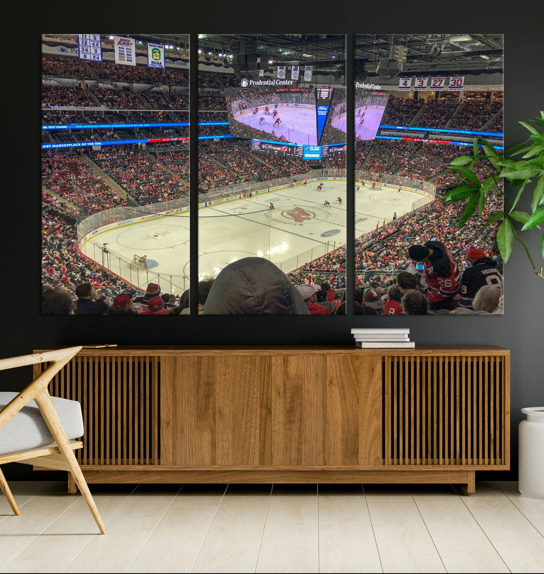 A living room showcases the Prudential Center Newark New Jersey Devils Hockey Stadium Wall Art Canvas Print, a large three-panel artwork depicting a packed hockey arena on museum-quality canvas.