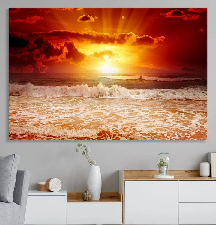 Red Sunset Ocean Beach Canvas Wall Art showcases a stunning three-panel masterpiece that captures a vivid beach sunset over ocean waves.