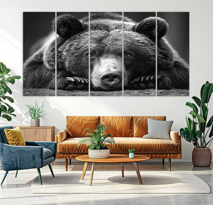 The black and white triptych, titled "Resting Grizzly 399 Bear Canvas Print," is a perfect gift for nature enthusiasts. Displaying a grizzly bear lying down, this wildlife art piece incorporates nautical elements like ships and a diving helmet, adding intriguing details to its rustic cabin and farmhouse decor vibe.