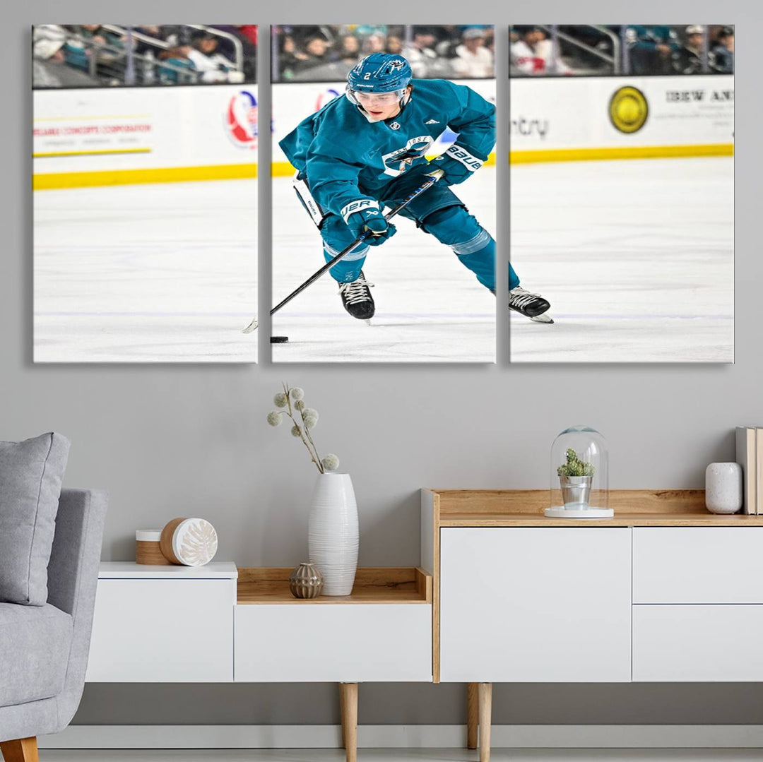 The San Jose Sharks Ice Hockey Player Wall Art Canvas Print beautifully depicts a hockey player in a teal uniform skating with the puck on ice during a game. Captured in vibrant colors and high-resolution, the spectators blur into the background, creating an artwork worthy of museum-quality presentation.