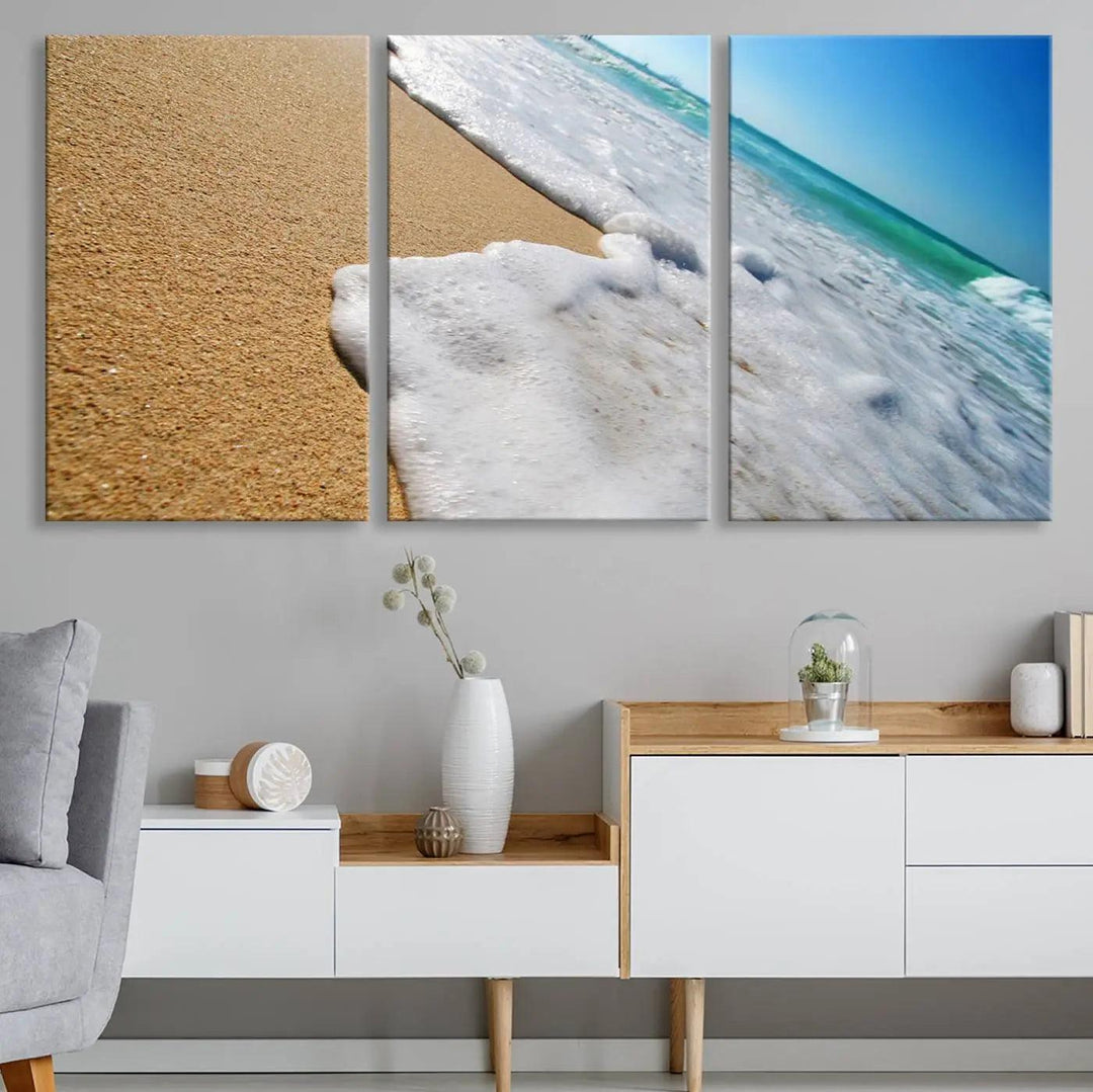 Sandy shoreline close-up ocean wave canvas print. Beach wall art with giclee canvas and gallery wrap, perfect for coastal living decor.