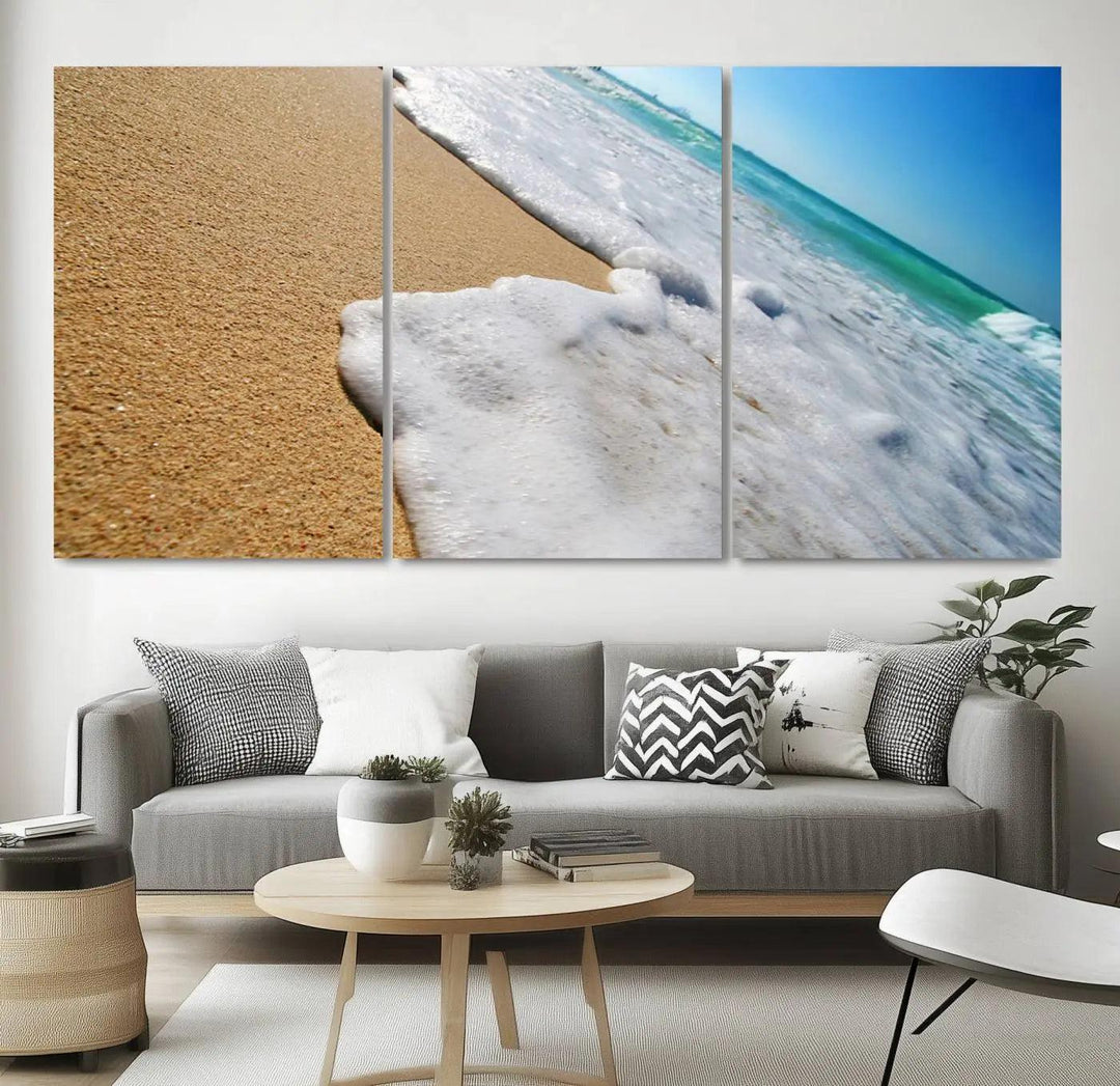 Sandy shoreline close-up ocean wave canvas print. Beach wall art with giclee canvas and gallery wrap, perfect for coastal living decor.