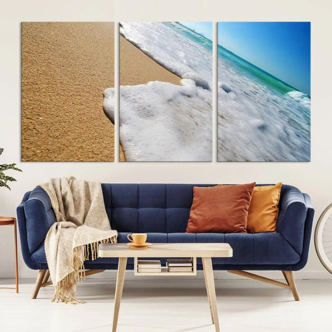 Sandy shoreline close-up ocean wave canvas print. Beach wall art with giclee canvas and gallery wrap, perfect for coastal living decor.